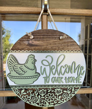Hen on a nest door sign