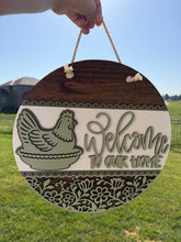 Hen on a nest door sign